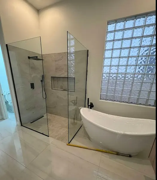 Modern bathroom with a glass shower and freestanding bathtub